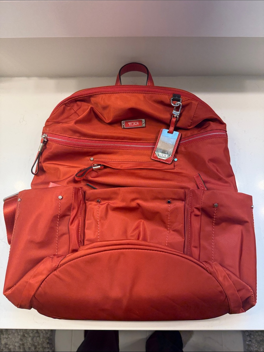 Tumi orange Backpack with Luggage Tag